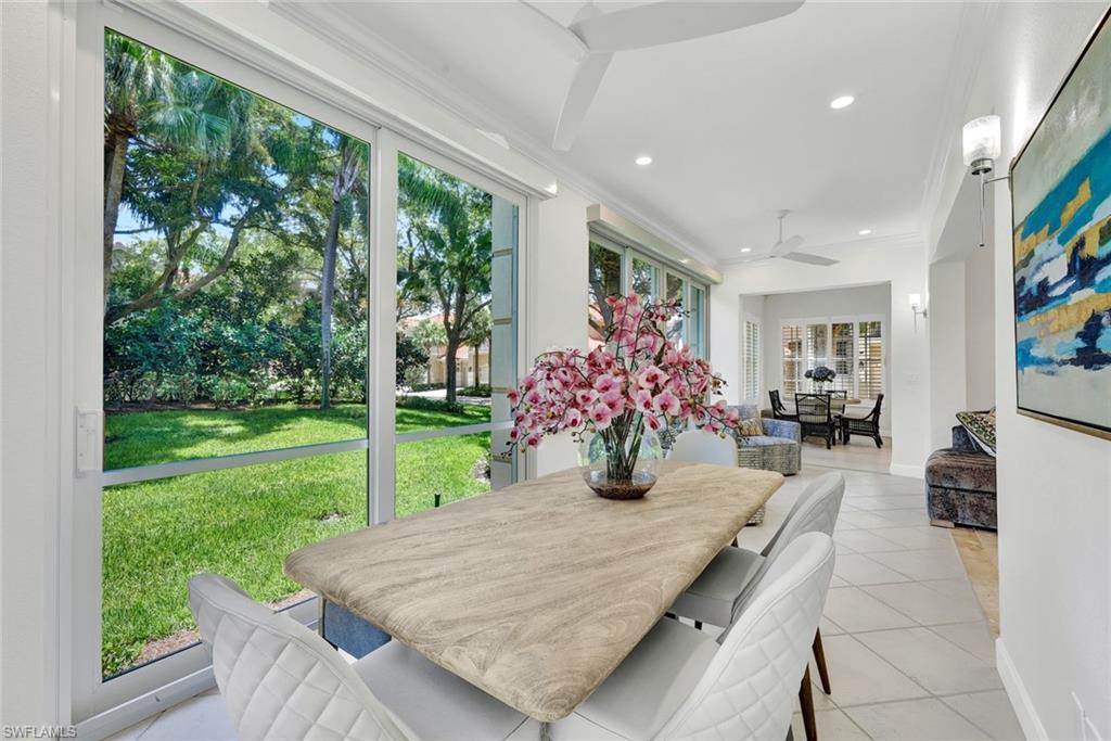 Indoor/outdoor dining at it's finest...just open the sliders to turn this indoor space into a lanai.