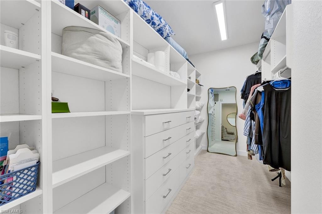 Primary suite features a huge walk-in closet has been thoughtfully renovated.