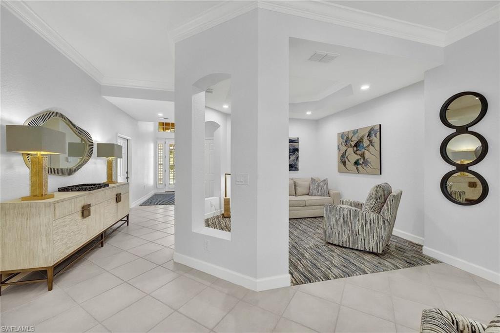 View of the formal living room and grand entryway from the great room.