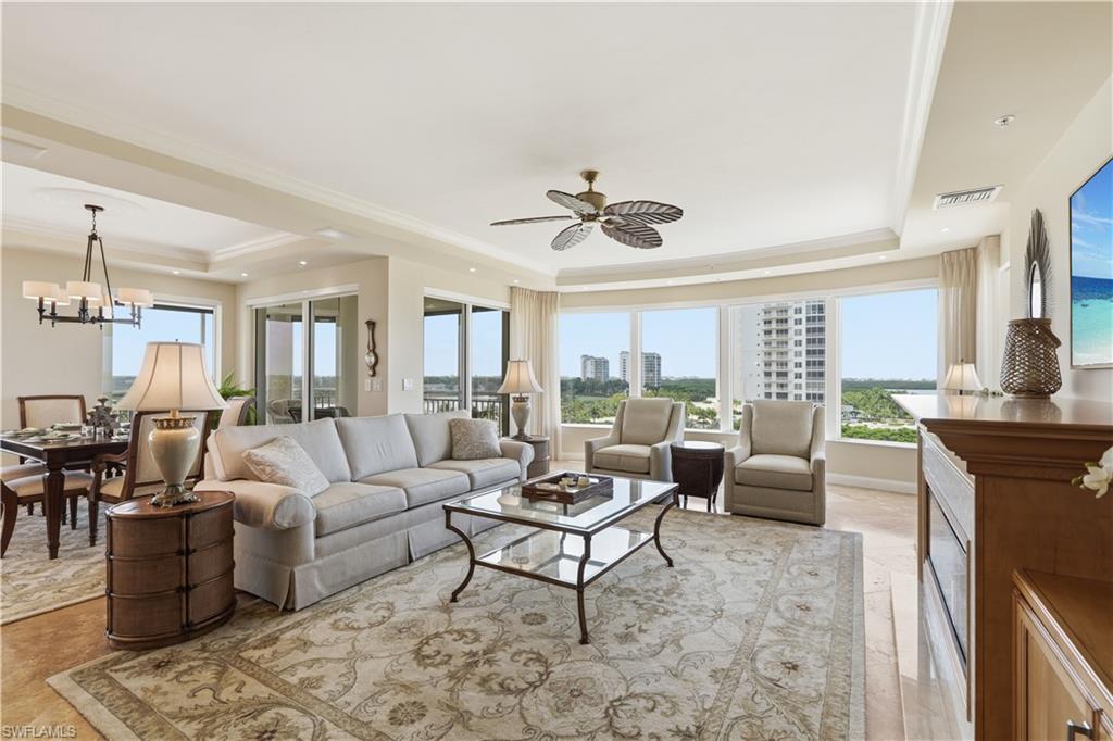 Spacious open-concept living and dining area filled with natural light and panoramic views.