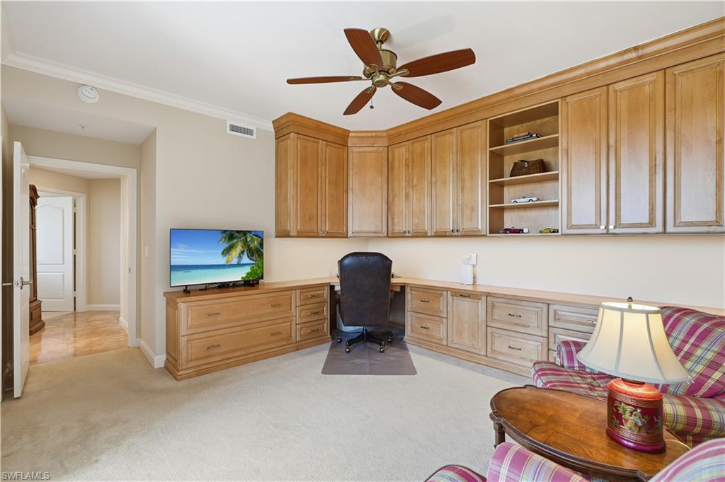 Built-in cabinetry and desk space make this room especially well suited for a home office or den.