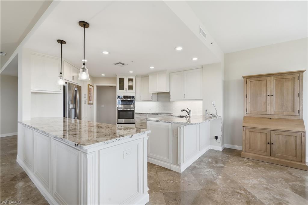 Large island, quartz countertops and plenty of room for food preparation.