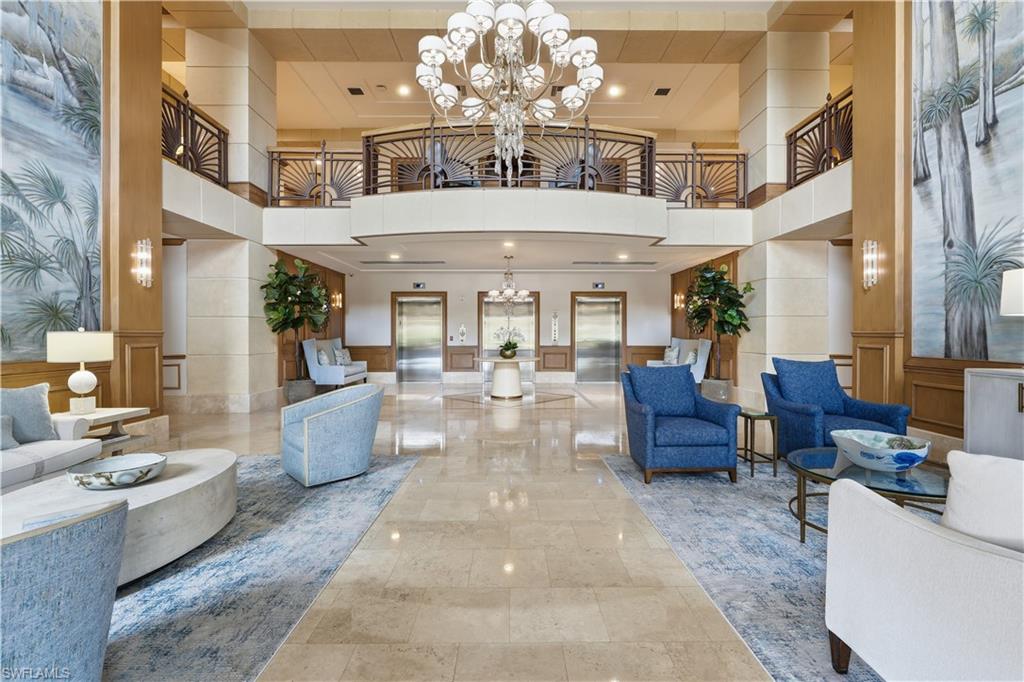 Impressive lobby with soaring ceilings and comfortable seating areas for residents and guests.