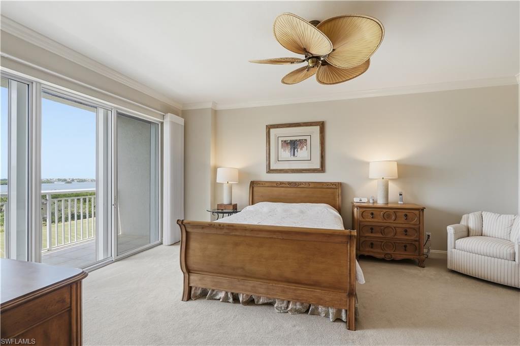 Wake up to the view—this generous primary bedroom features large windows and direct outdoor access.