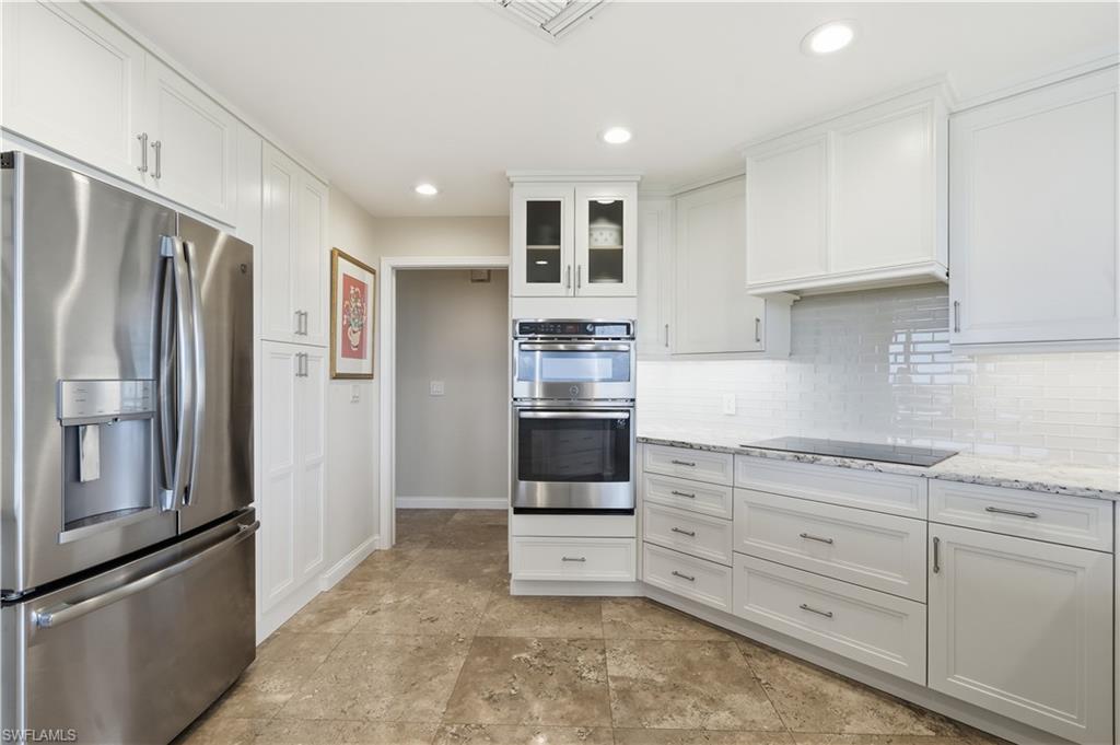 Plenty of pantry space to the right of the refrigerator.