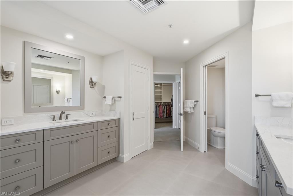 Excellent counter space and storage make this primary bath especially functional.