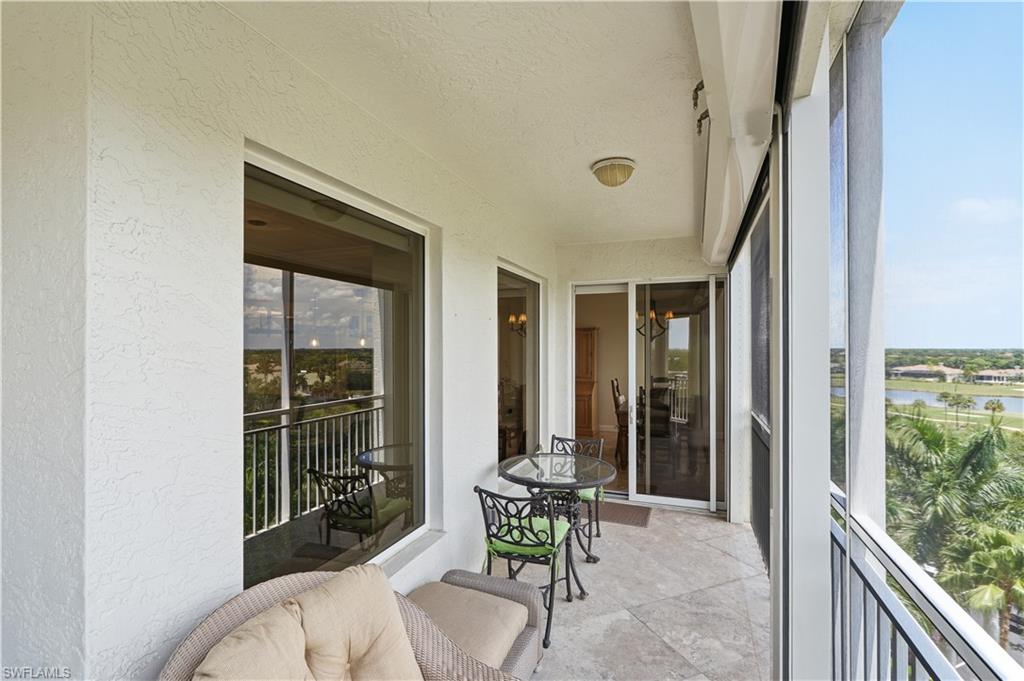 Generous covered lanai extends the living space outdoors and overlooks the lush surroundings.