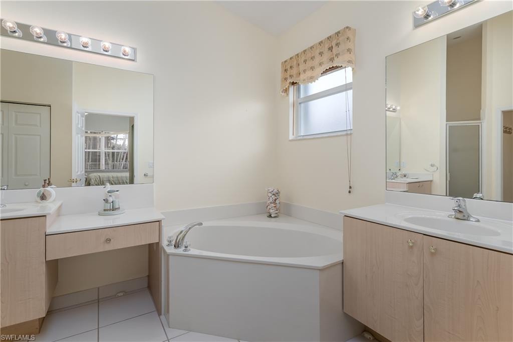 Corner soaking tub, dual vanity sinks,