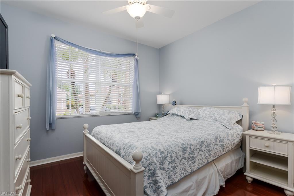Hardwood-style flooring, ceiling fan, window with horizontal blinds, and recessed lighting
