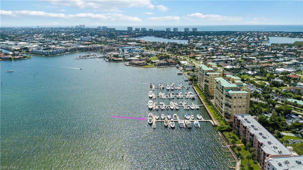 View of urban area with a nearby body of water and a marina