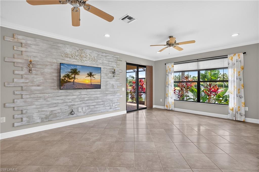 Living room with custom accent wall and a TV that stays with the home.