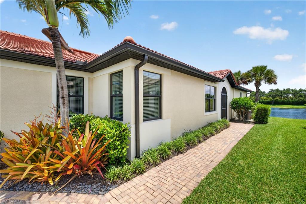 Paver sidewalk and tranquil water views.