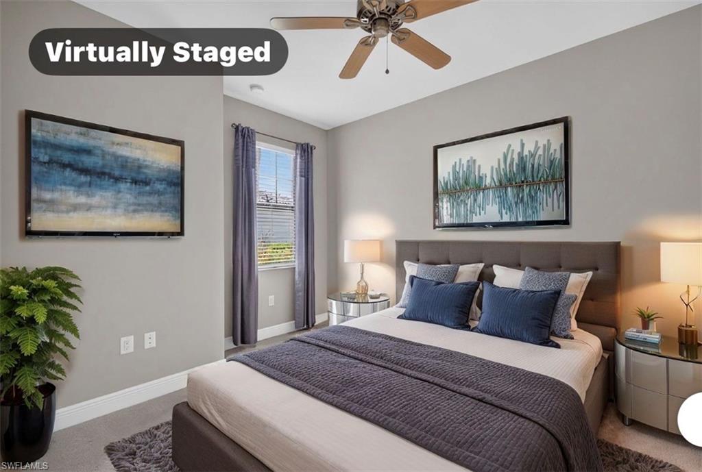 Guest bedroom featuring a window with blinds, curtains, ceiling fan, and light gray wall paint
