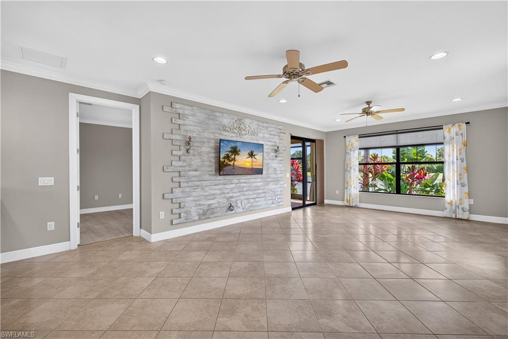 Living room with custom accent wall and a TV that stays with the home.