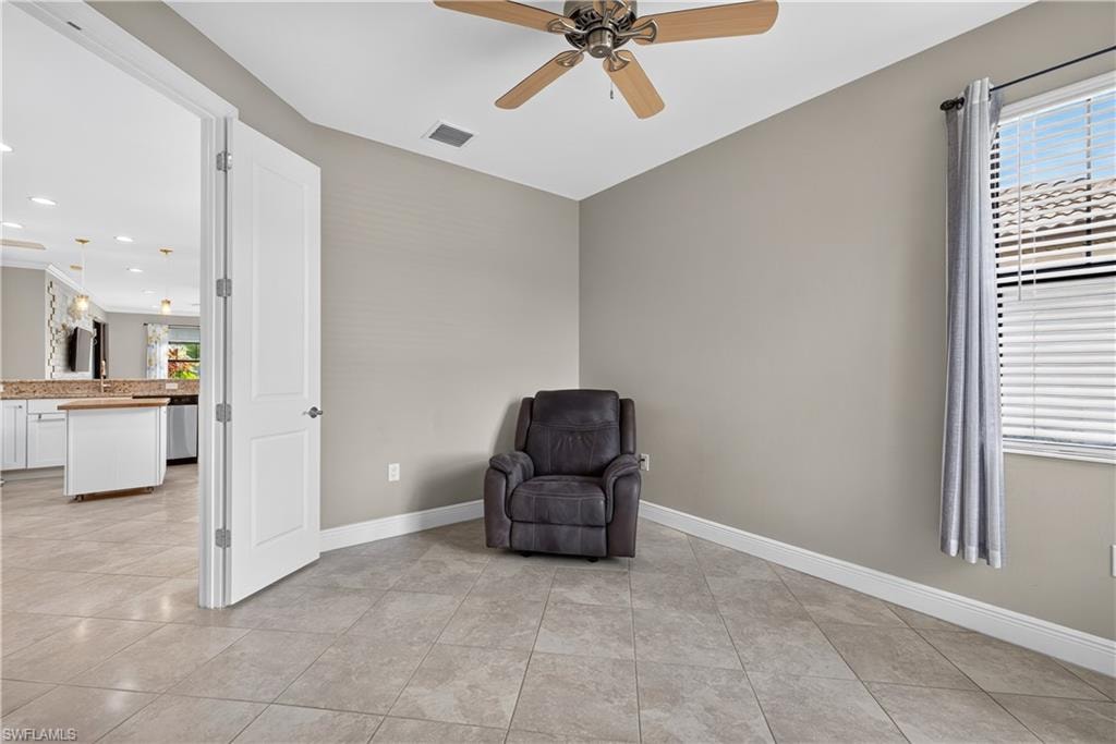 French doors lead into the large den that can be used as an office and/or a third bedroom.