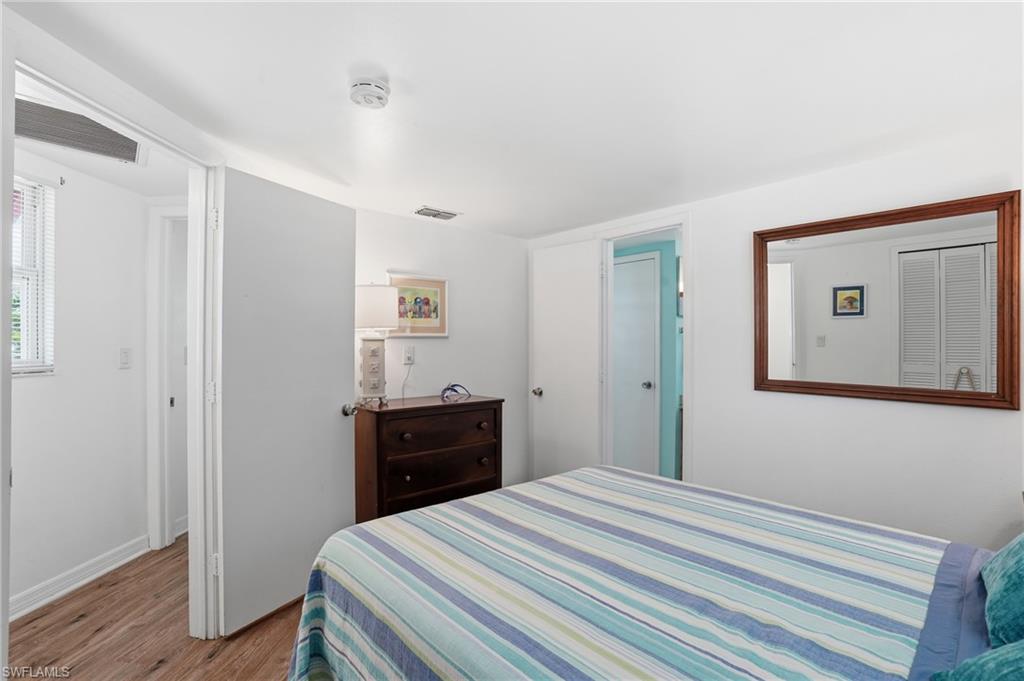 White walls with wood-finish flooring - Virtually Edited Image