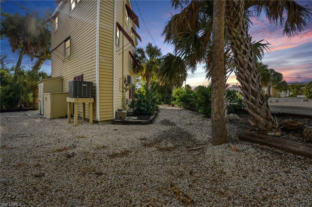Property exterior at dusk with a cooling unit - Virtually Edited Image