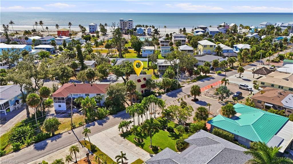 Aerial perspective of suburban area featuring a large body of water - Virtually Edited Image