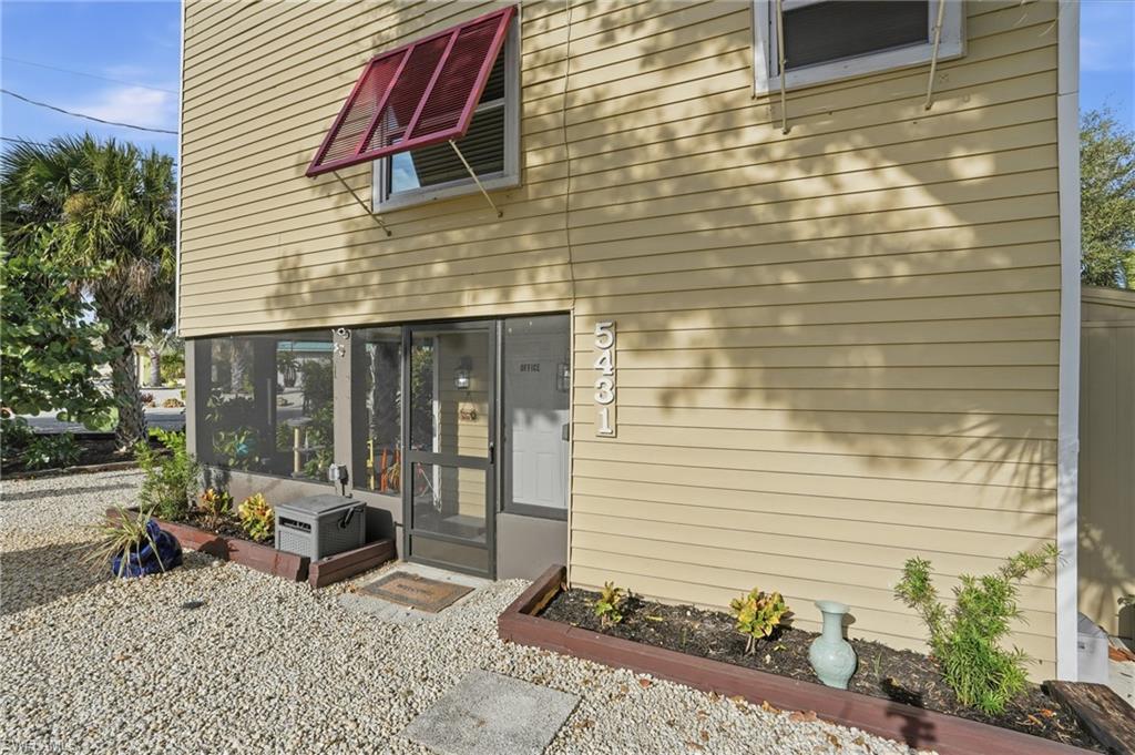 Doorway to property featuring a sunroom - Virtually Edited Image