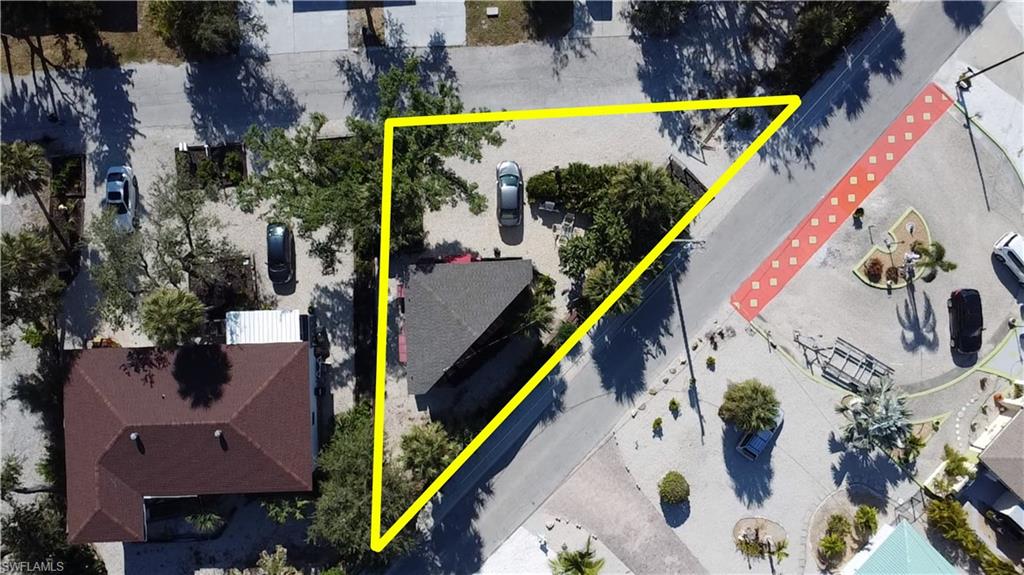 Aerial overview of property's location with property parcel outlined - Virtually Edited Image