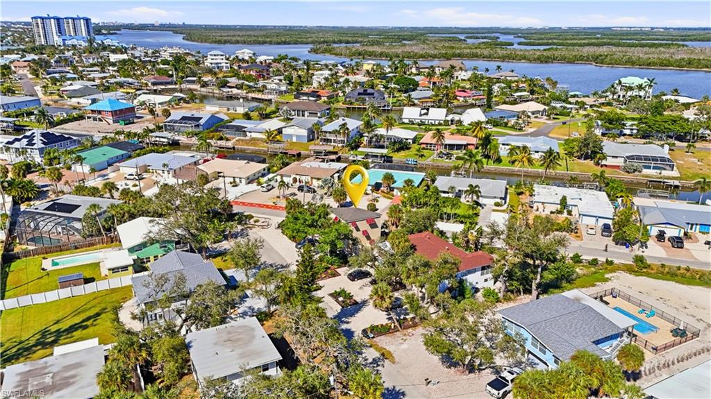 Aerial view of residential area with a large body of water - Virtually Edited Image