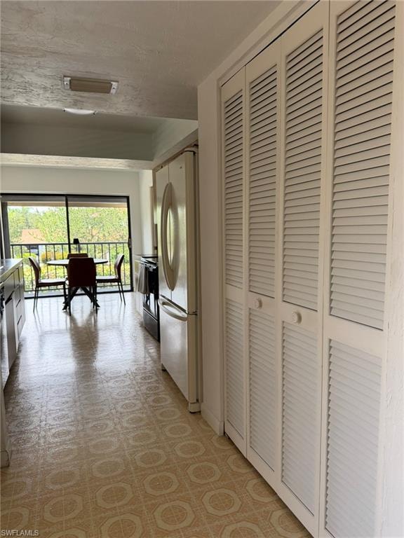 White louvered bifold doors offering extensive storage space