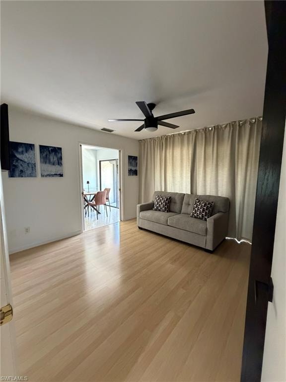 Light wood-finish flooring complements the neutral wall tones