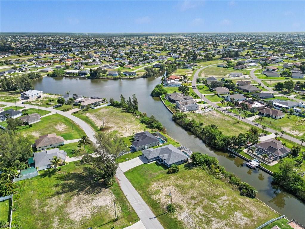 Aerial perspective showcasing a residential area with canal access