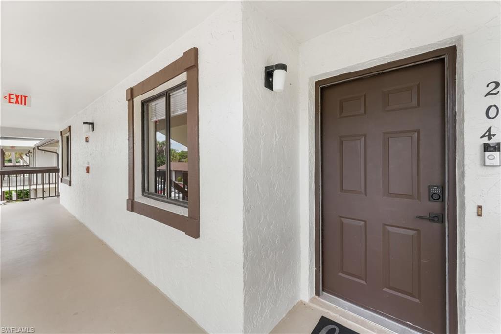 Entry door featuring multi-panel design and smart lock system