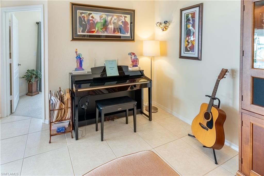 Sitting room with light tile patterned floors