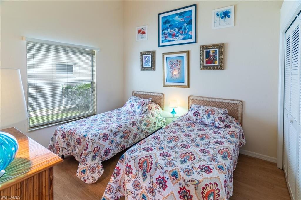 Bedroom featuring wood finished floors and a closet