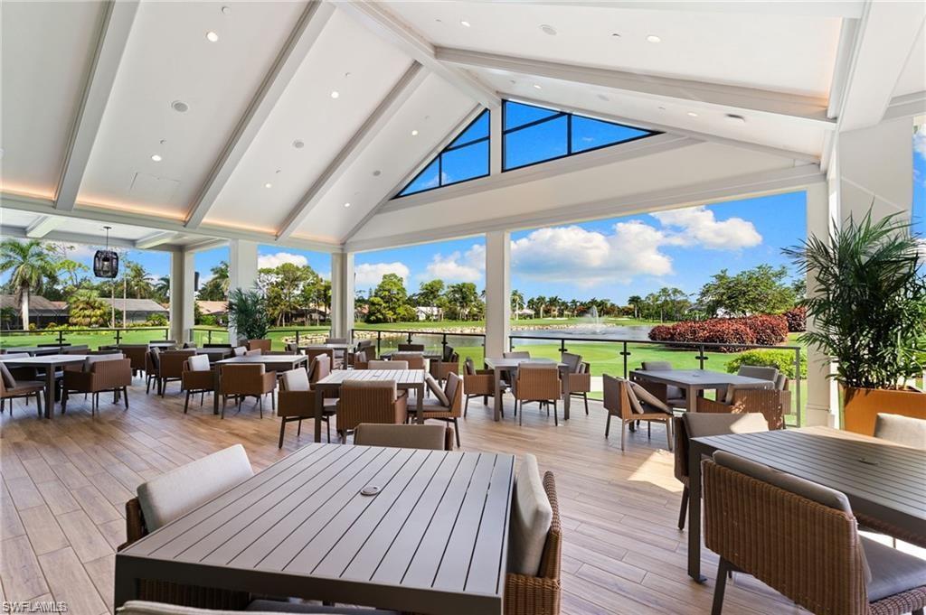 Wooden deck featuring outdoor dining area and a water view