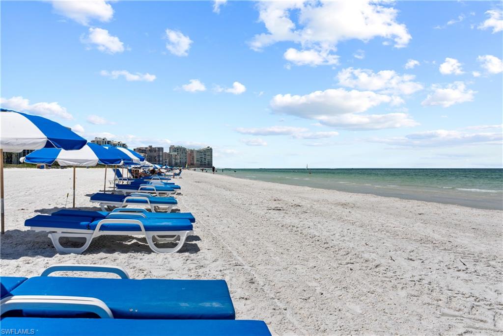 Expansive sandy beach with calm ocean waters
