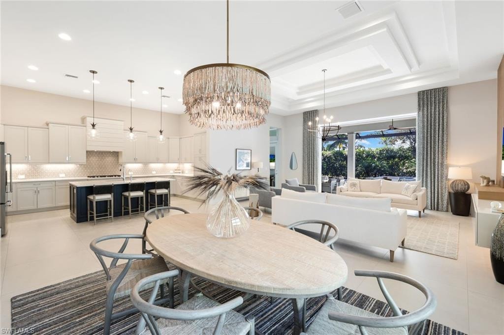 Open-concept living space featuring a gourmet kitchen, dining area, and living room
