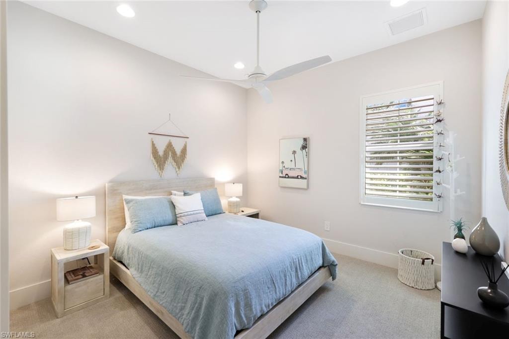 Bedroom featuring a single window with plantation shutters, recessed lighting, a ceiling fan, and carpeted flooring