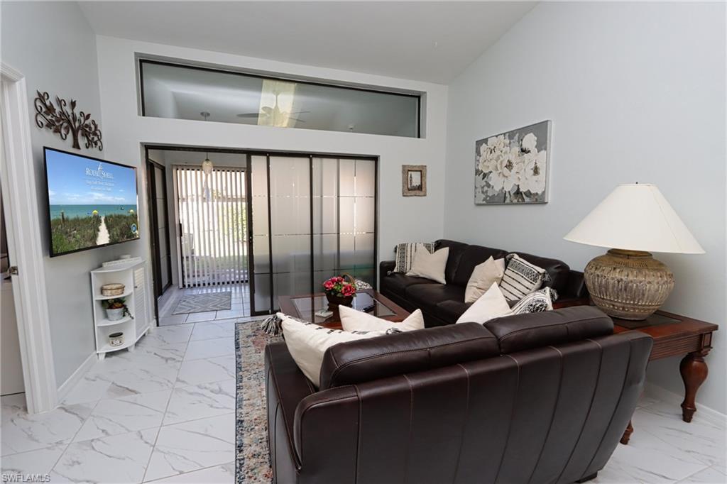 Living room with high vaulted ceiling