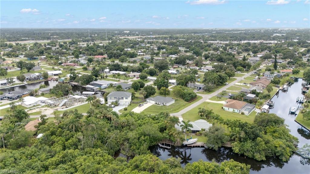 Residential neighborhood featuring numerous canals and mature trees