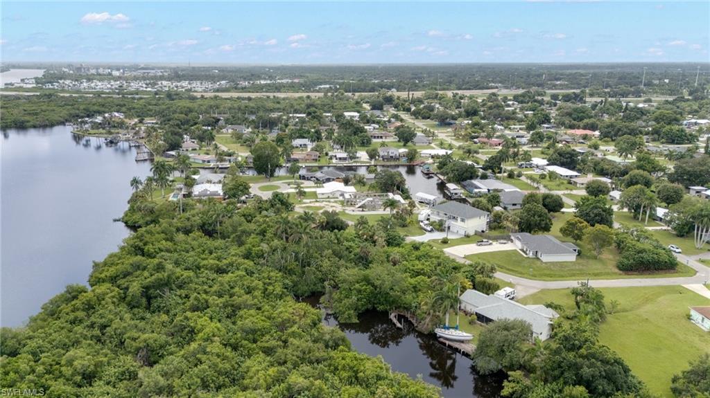 Waterfront community featuring canal access, mature trees, and a residential neighborhood setting