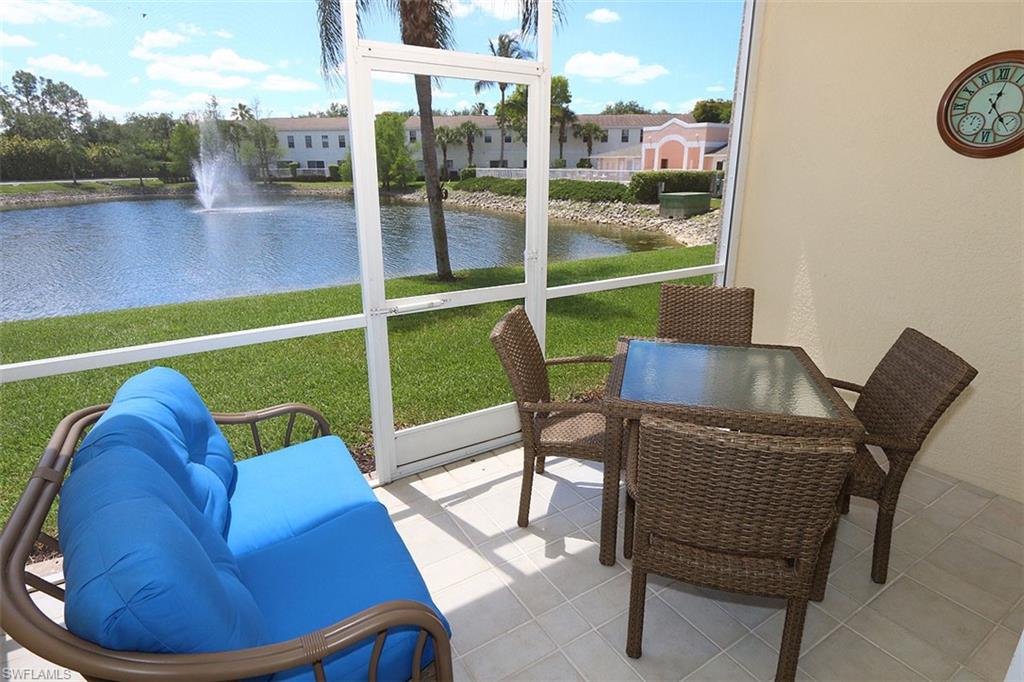 Sunroom with a water view