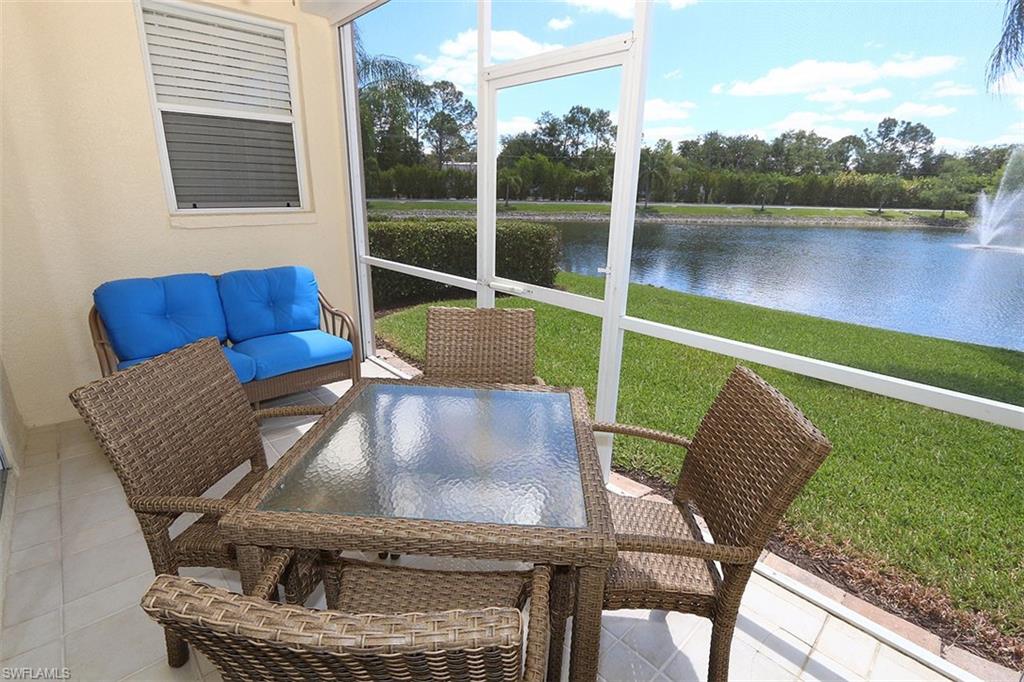 Sunroom / solarium with a water view