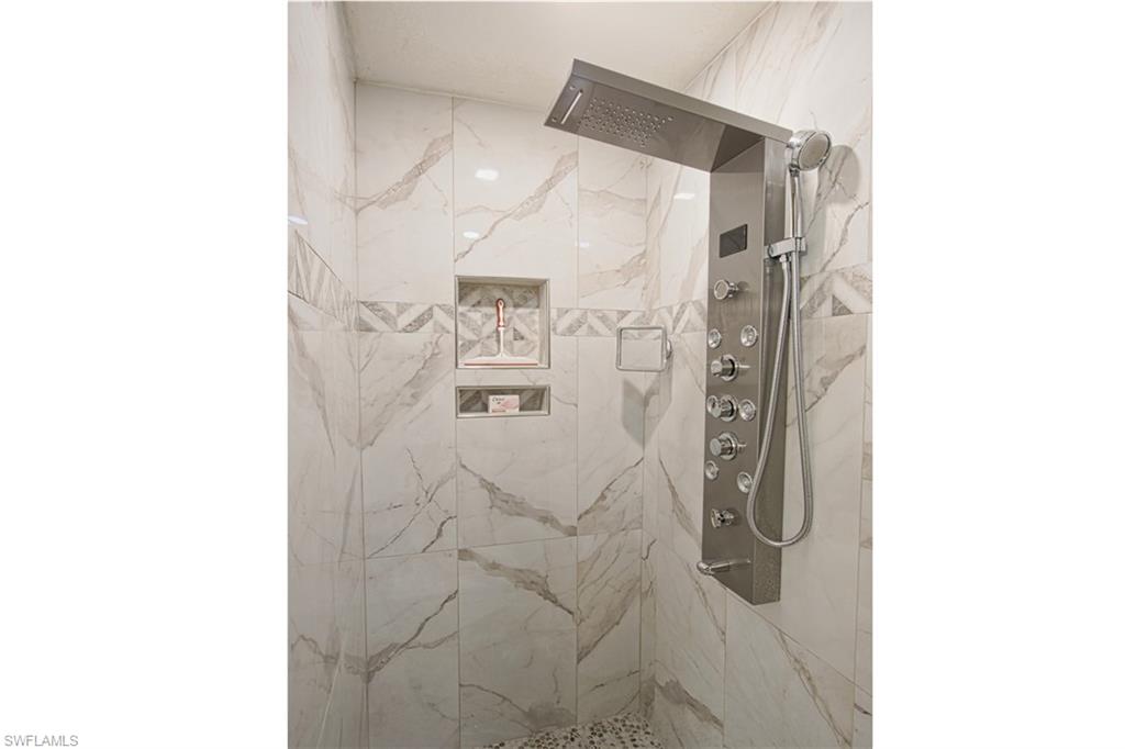 Details with a tile shower