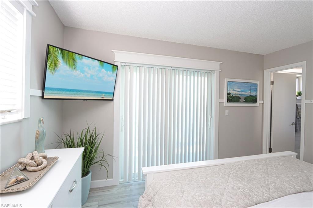Bedroom featuring light wood finished floors and a textured ceiling