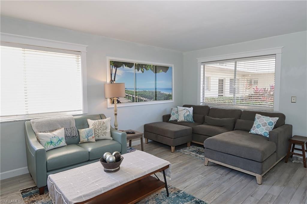 Living room with light hardwood / wood-style flooring