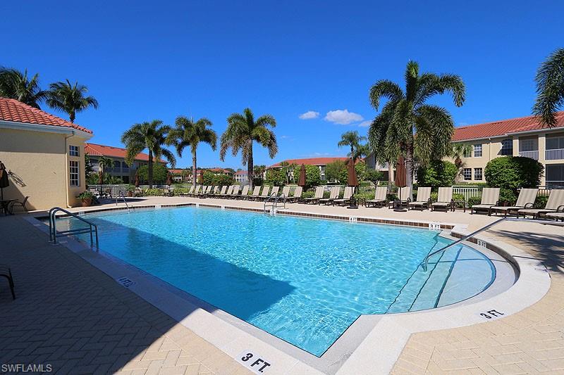 Community pool with a patio area