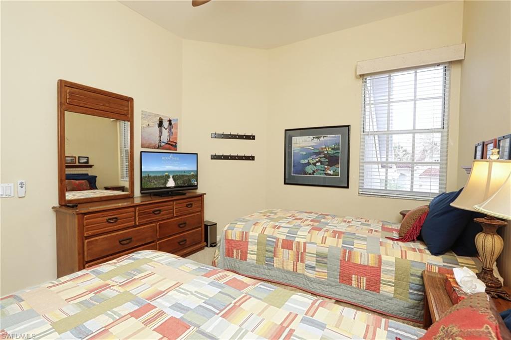 Bedroom featuring ceiling fan and light carpet