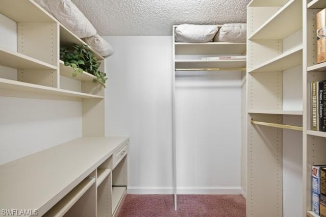 Built-in closet system featuring multiple shelving units, integrated desk space, and hanging rods