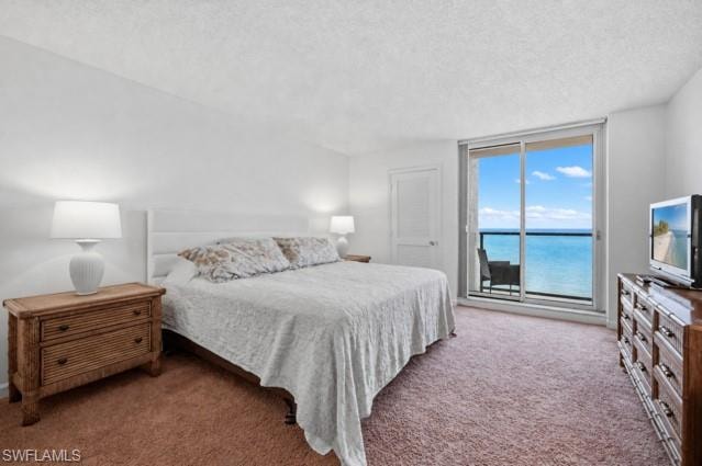 Sliding glass doors opening to a balcony with ocean scenery