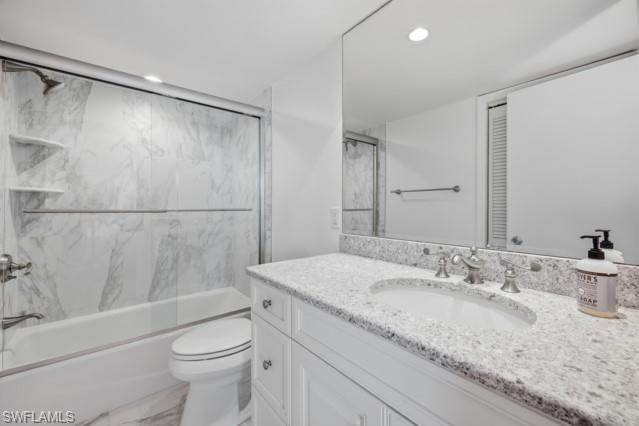 Bathroom vanity with a granite countertop, undermount sink, and brushed nickel faucet