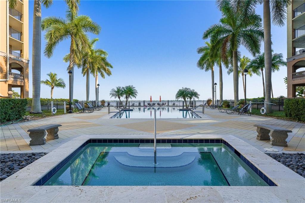 View of pool with a water view
