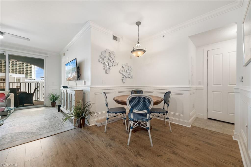 Dining room featuring hardwood / wood-style flooring and ornamental molding